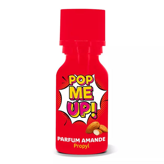 on voit sur un fond blanc un flacon rouge de poppers dont le nom est Pop me up. Le nom est écrit dans le style pop art en jaune et rose et on voit que son parfum est amande avec une photo d'amandes sur le flacon.