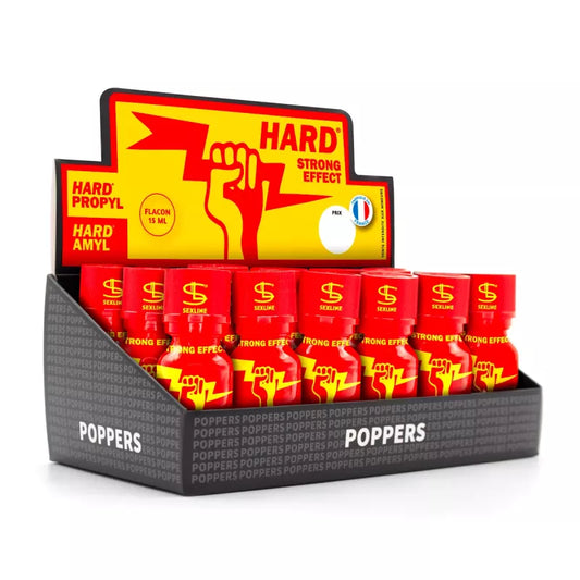 on voit sur un fond blanc un pack présentoir du poppers Hard. Le carton est noir jaune et rouge il contient plusieurs flacons de ce poppers dont chaque flacon est rouge.